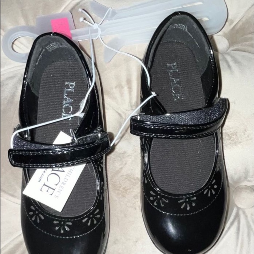 The children place dress shoes